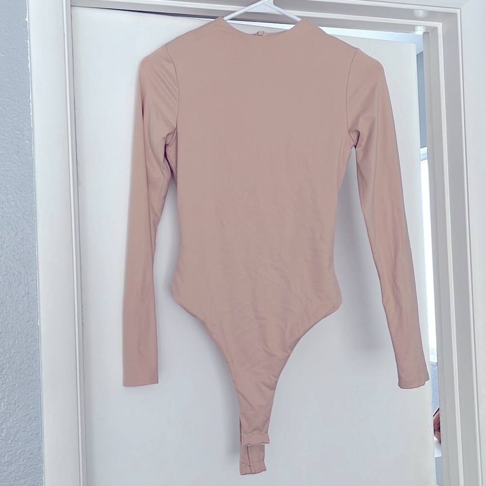 Bodysuit. Tan/beige. Long sleeve. Work once. No stains/markings.